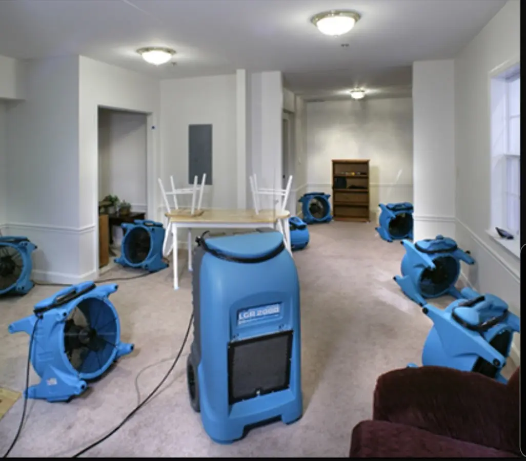 Air movers and dehumidifier setup for Water Damage Restoration in Havre